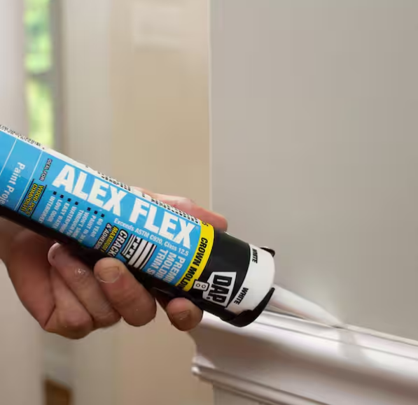 Professional caulking of trim and baseboards for a smooth, seamless paint finish – interior painting prep in Southeast Michigan homes.