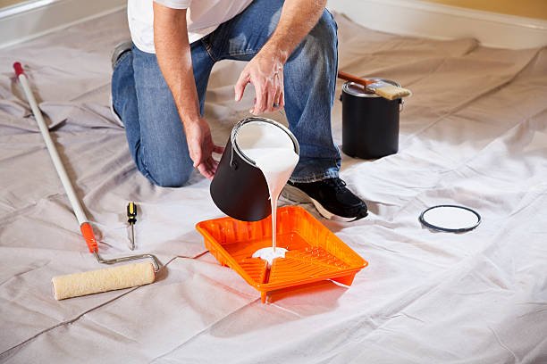 Average cost to paint a home in Downriver - professional pouring paint