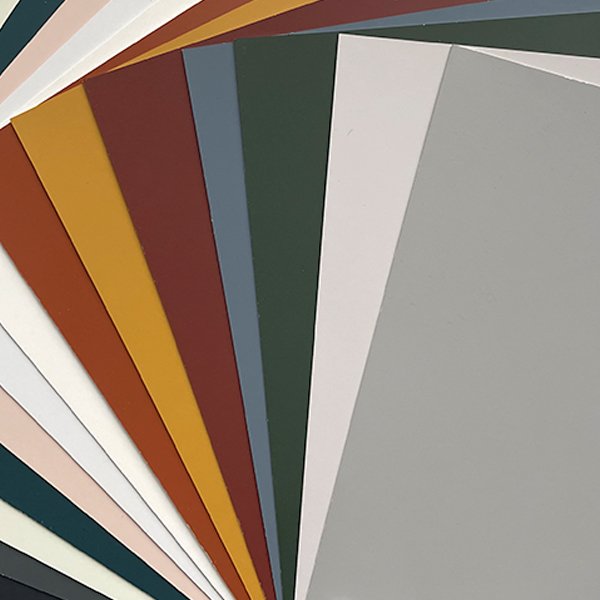 Exterior color swatches held up to house