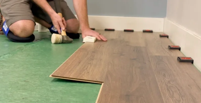 Flooring installation project with clean transitions and baseboards.
