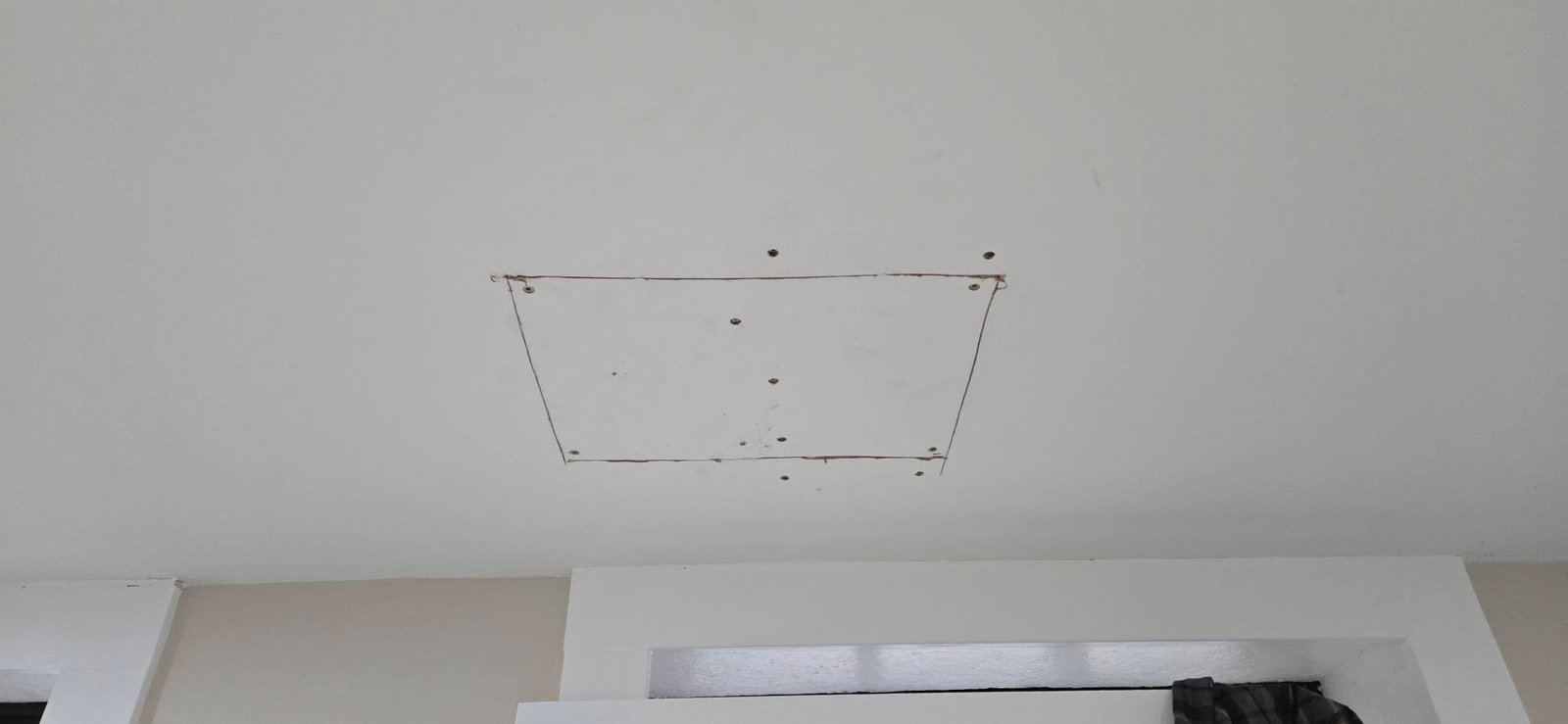 Damaged drywall before professional repair