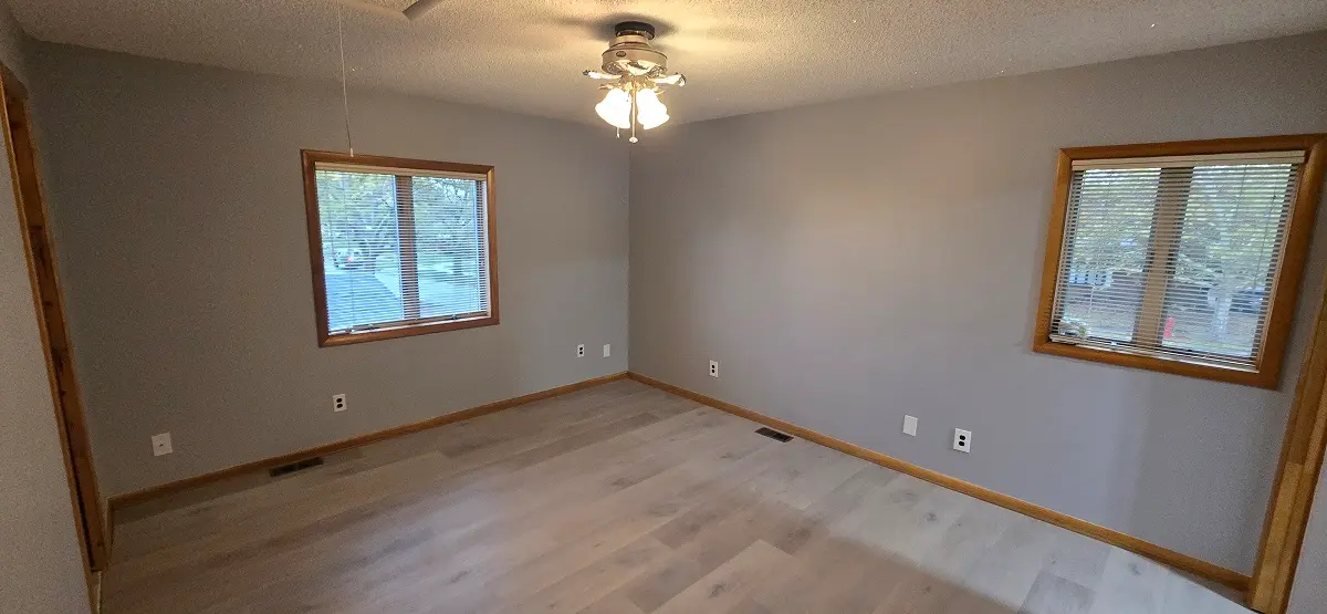 Fully renewed drywall and freshly painted room in a Woodhaven Michigan home with smooth finished walls