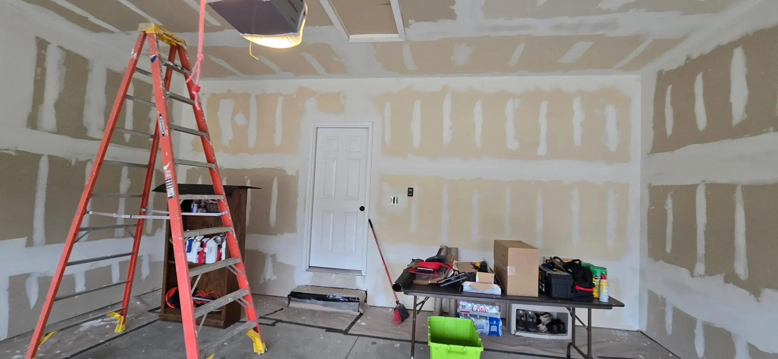 Unfinished garage drywall with fire-taped seams in Brownstown Township MI home