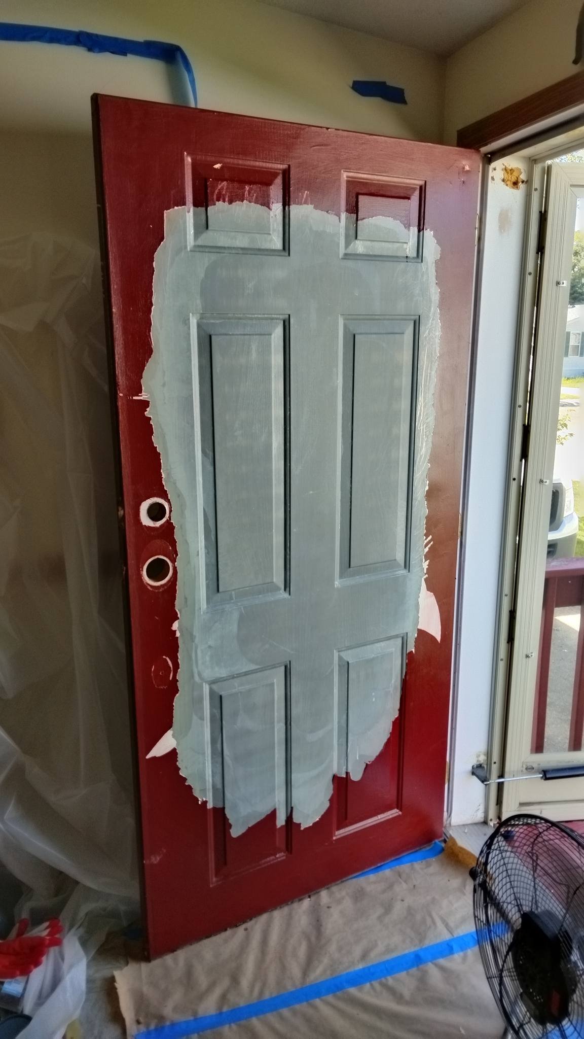 Exterior front door peeling paint before restoration in Grosse Ile MI